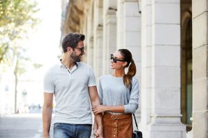 Shot of an affectionate young couple walking together in the city